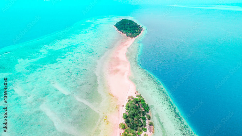 A small island with a sandbar to cross both islands in Sabah. Mataking Island, Sabah, Malaysia