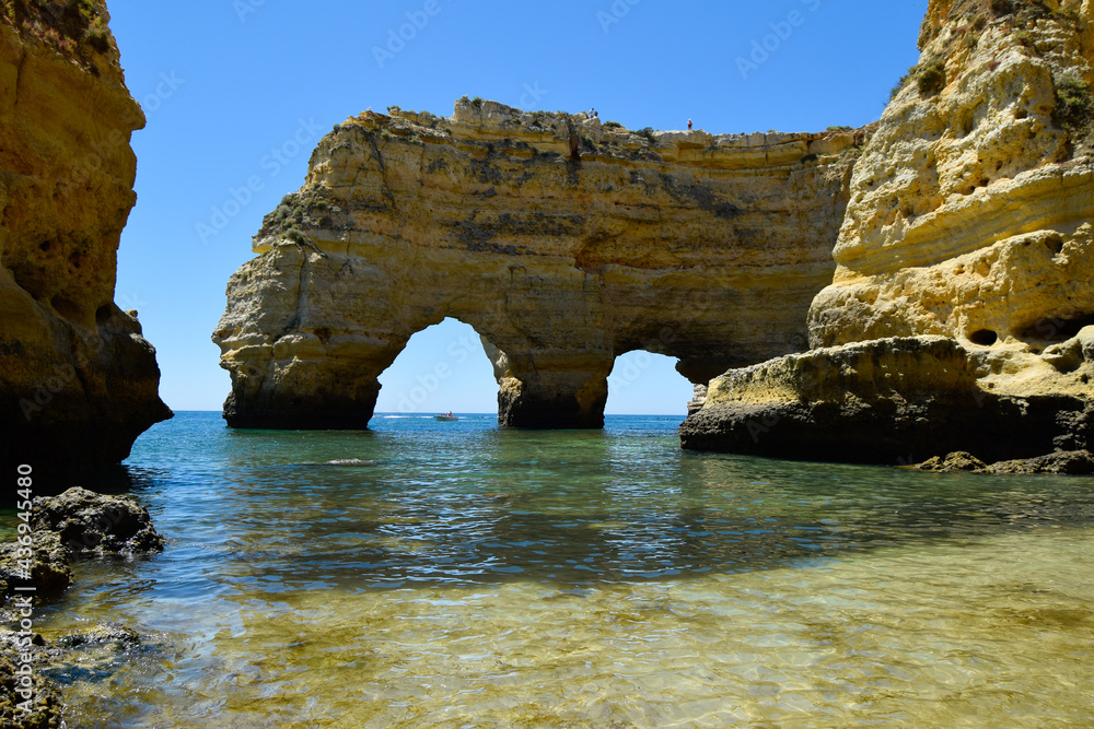 Rocks on the beach, beach view from Algarve south Portugal. Rock arches. 