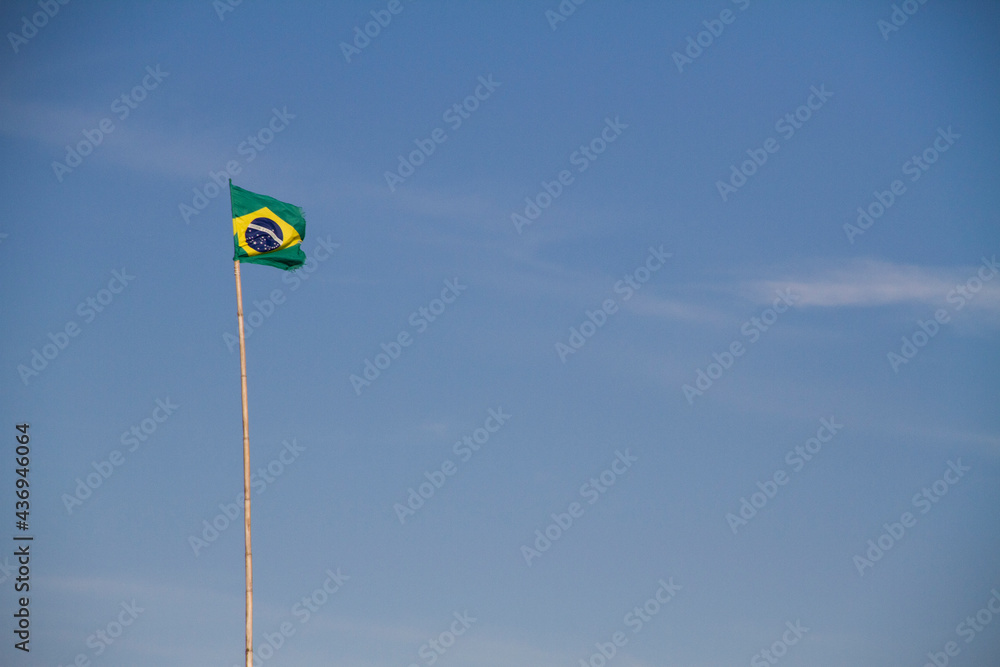Brazilian flag in a long pole