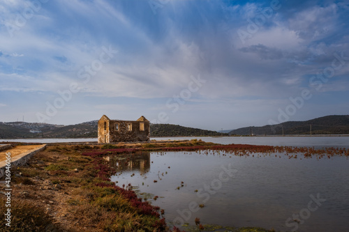 Dorttepe, Milas, Kavaklarbogazi Creek or bay of Aegean sea in Turkey. October 2020. Old ruined building and bay, where you can often find pink flamingos
