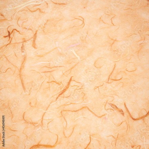 background of light brown textured handmade mulberry paper