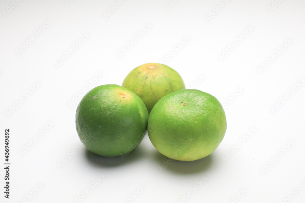 Fresh lime isolated on white background. Texture pattern juicy green tropical lime fruit. Image green limes Fresh lime isolated on white background. Texture pattern juicy green tropical lime fruit. Image green limes