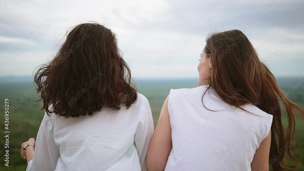 Happy young attractive girl friends having fun. Lesbian couple spending time together in sunny day. LGBTQ concept. Travelling couple doing sightseeing. Diverse love pride. Happy young attractive girl friends having fun. Lesbian couple spending time together in sunny day. LGBTQ concept. Travelling couple doing sightseeing. Diverse love pride.