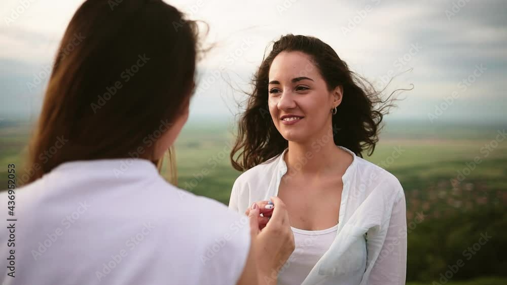 Happy young attractive girl friends having fun. Lesbian couple spending time together in sunny day. LGBTQ concept. Travelling couple doing sightseeing. Diverse love pride. Happy young attractive girl friends having fun. Lesbian couple spending time together in sunny day. LGBTQ concept. Travelling couple doing sightseeing. Diverse love pride.