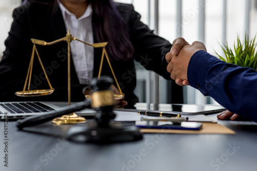 Consultation and conference of professional businesswoman and Male lawyers working and discussion having at law firm in office. Concepts of law, Judge gavel with scales of justice