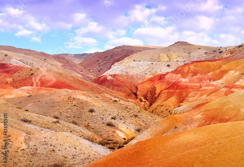 Mars in the Altai Mountains. The slope of the river terrace with the exposure of colorful clays and siltstones under the blue sky is a geological attraction. Chui Valley  Siberia  Russia