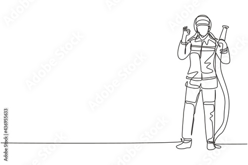 Single one line drawing firefighters stood wearing helmets and uniforms complete with gesture okay work to extinguish fire at building. Modern continuous line draw design graphic vector illustration