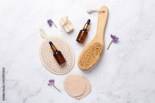 Natural spa, wellness composition with natural products and reusable bathroom tools on marble background. Zero waste concept
