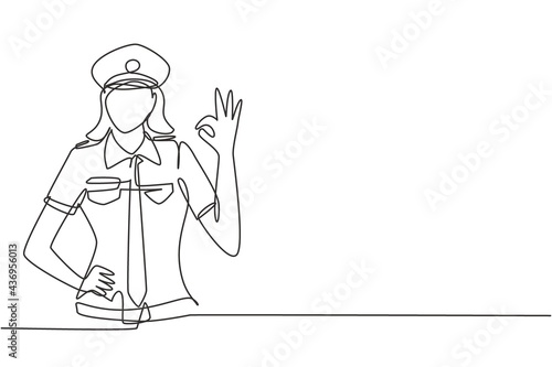 Single continuous line drawing female pilot with gesture okay and uniform ready to fly with cabin crew in aircraft at international airport. Dynamic one line draw graphic design vector illustration