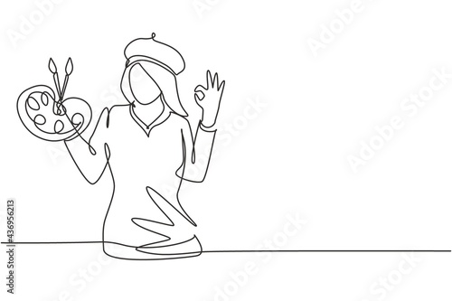 Single one line drawing female artist painter with gesture okay using painting tools such as brushes, canvas, and watercolors in producing art. Continuous line draw design graphic vector illustration