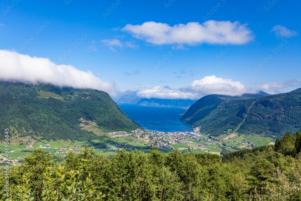 Mountains valley with village Vik on fjord, Norway