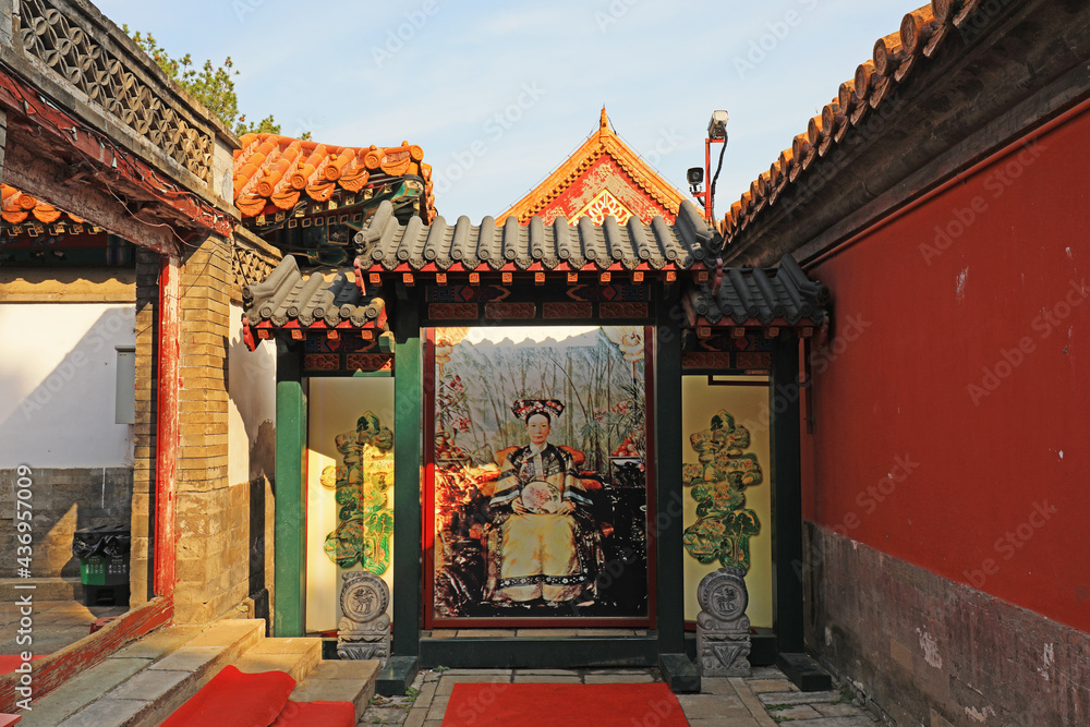 Photos of Empress Dowager Cixi of the Qing Dynasty are set on the wall of the summer palace in Beijing