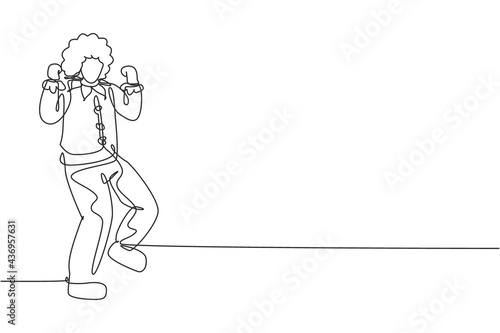 Single one line drawing clown stands with celebrate gesture wearing wig and clown costume ready to entertain audience in circus arena. Modern continuous line draw design graphic vector illustration