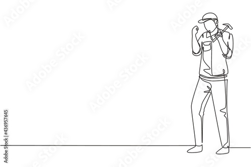 Single one line drawing carpenter standing with celebrate gesture works for wood industry and must be skilled at using carpentry tools. Modern continuous line draw design graphic vector illustration