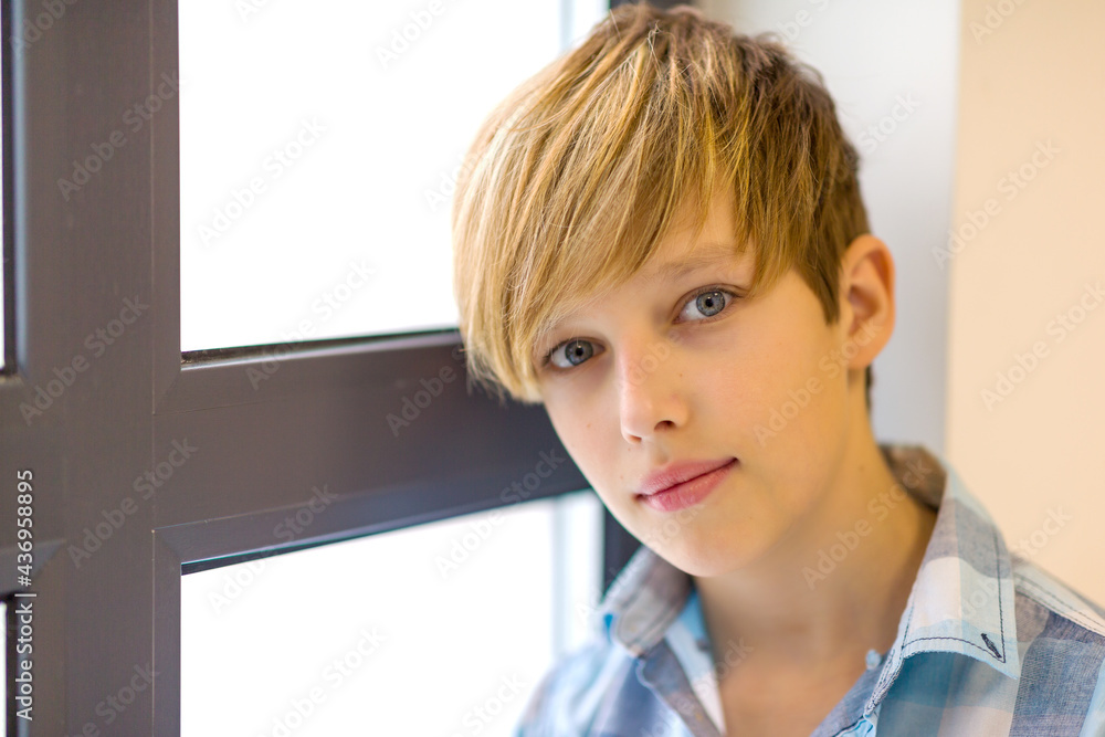 Teenage boy hand looking out of window Teenage boy hand looking out of window