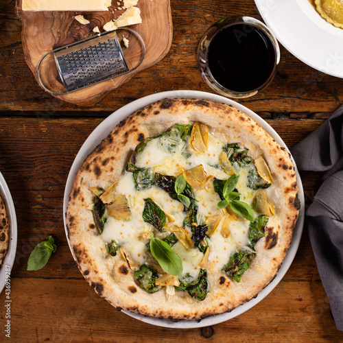 Pizza bianca or white pizza with artichokes and basil