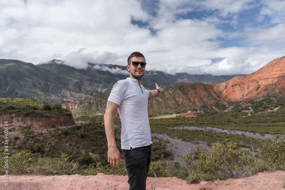 hispanic young man with sunglasses enjoying beautiful mountain scenery - fresh air concept - latinx hispanic young man with sunglasses enjoying beautiful mountain scenery - fresh air concept - latinx