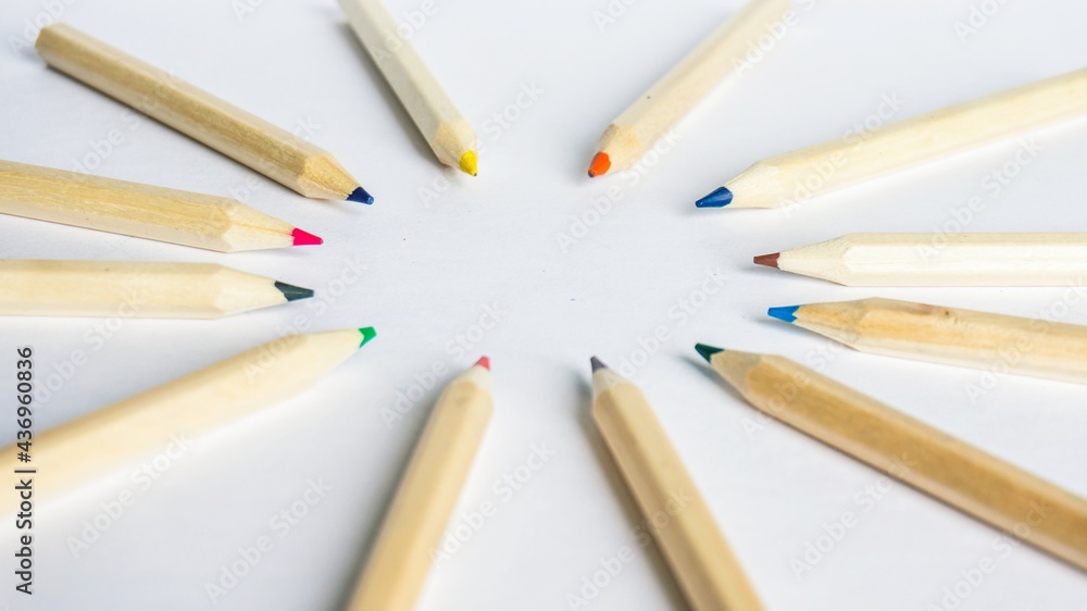 Obraz premium Kid Art education concept. Color pencils on white paper background. copy space