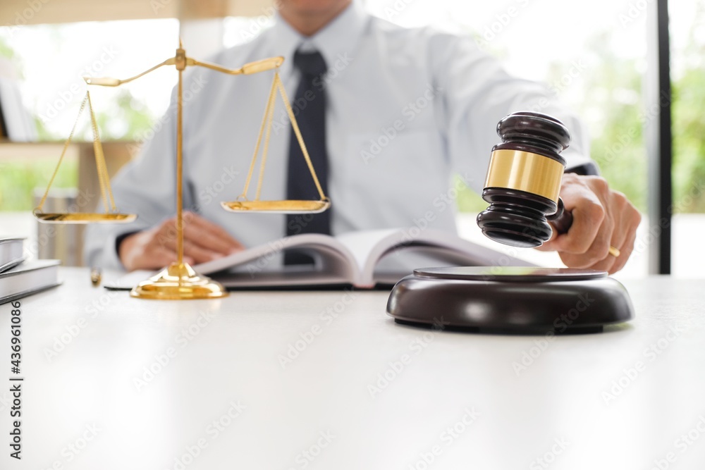 Lawyer Legal counsel presents to the client a signed contract with gavel and legal law. justice and lawyer Business partnership meeting concept. Lawyer Legal counsel presents to the client a signed contract with gavel and legal law. justice and lawyer Business partnership meeting concept.