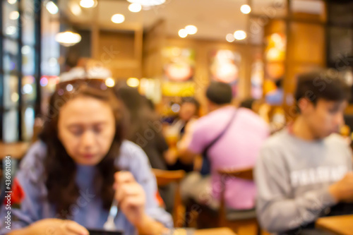 blurred people in restaurant