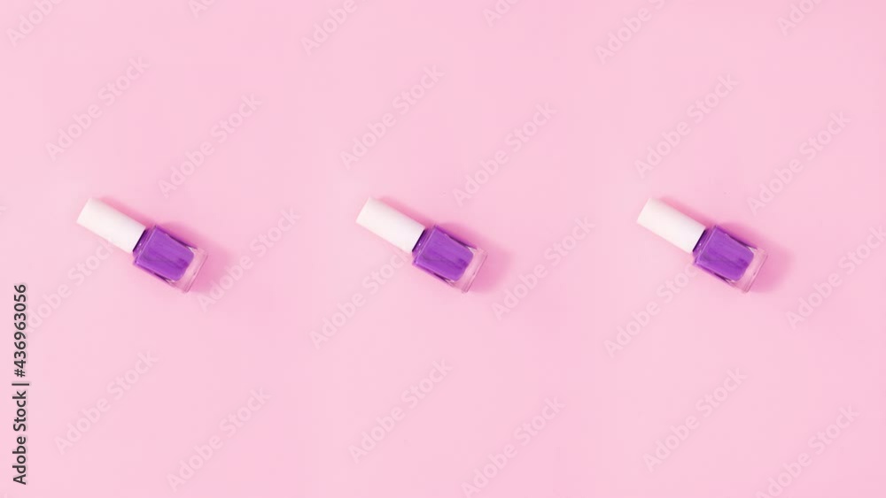 Three nail polish bottles rotate and change colors. Stop motion Three nail polish bottles rotate and change colors. Stop motion