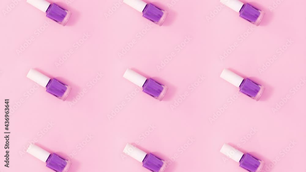 Beauty pattern made of nail polishes bottles rotate and change colors. Stop motion Beauty pattern made of nail polishes bottles rotate and change colors. Stop motion