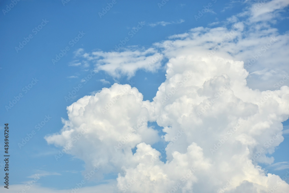 Beautiful cumulus clouds against the blue daytime sky. Beautiful cumulus clouds against the blue daytime sky.