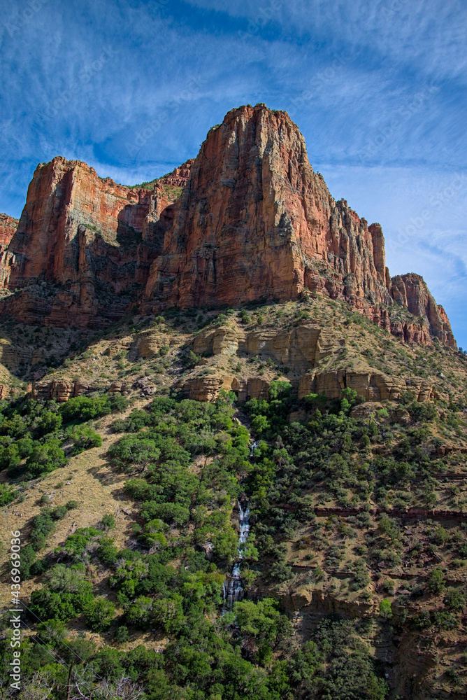 View of grand canyon bluff wall showing rock layers geological timeline from bottom of canyon on north kaibab bright angel hiking trail.