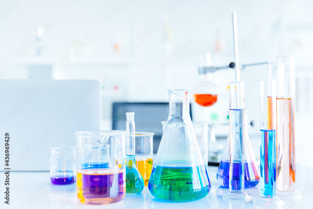 Glass flask in Science Chemical laboratory or Medical research lab with colorful liquid for background Glass flask in Science Chemical laboratory or Medical research lab with colorful liquid for background