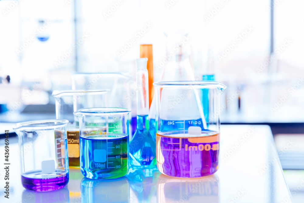 Colorful mix chemical in science glassware flask at lab science. beautiful chemistry laboratory background. Colorful mix chemical in science glassware flask at lab science. beautiful chemistry laboratory background.