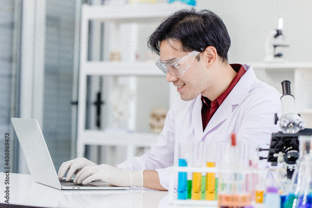 Scientist doctor or Medical laboratory technologist working online in hospital medicine lab with laptop computer happy smile face. Scientist doctor or Medical laboratory technologist working online in hospital medicine lab with laptop computer happy smile face.