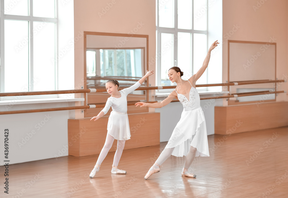 Little ballerina training with coach in dance studio Little ballerina training with coach in dance studio