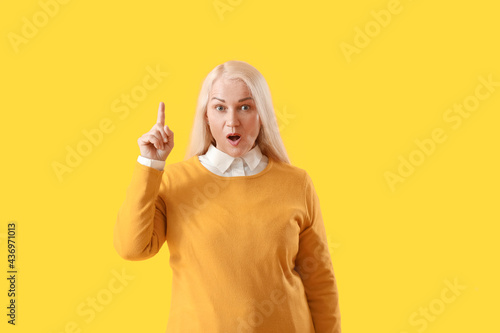 Mature woman with raised in...