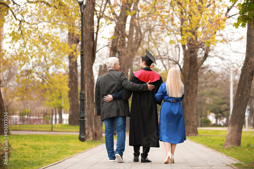 Young man with his parents ...