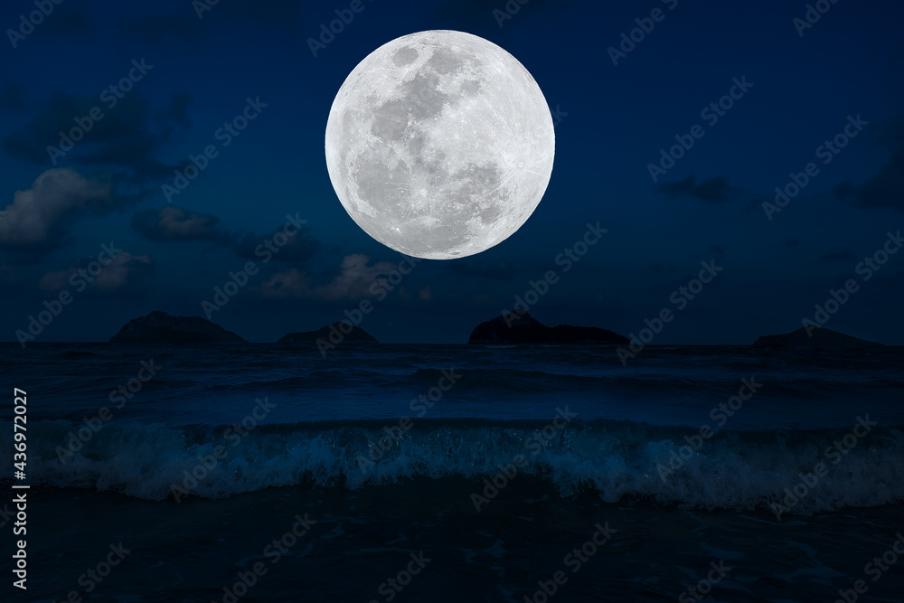 Full moon on sky over sea in the night. Full moon on sky over sea in the night.