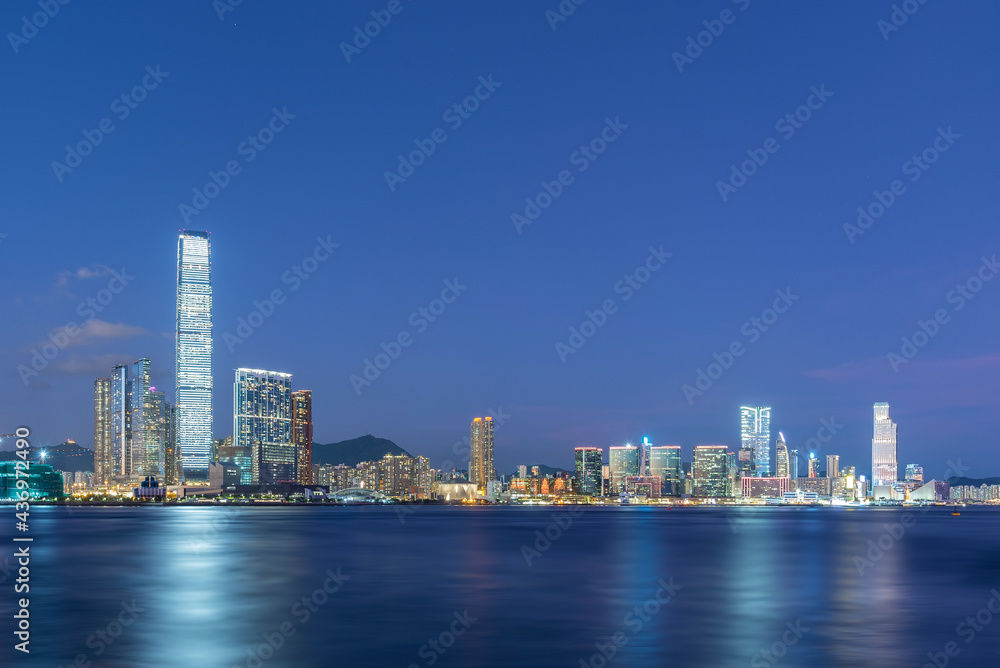 Panorama of skyline of Victoria harbor of Hong Kong city at dusk