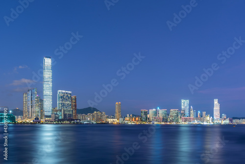 Panorama of skyline of Victoria harbor of Hong Kong city at dusk