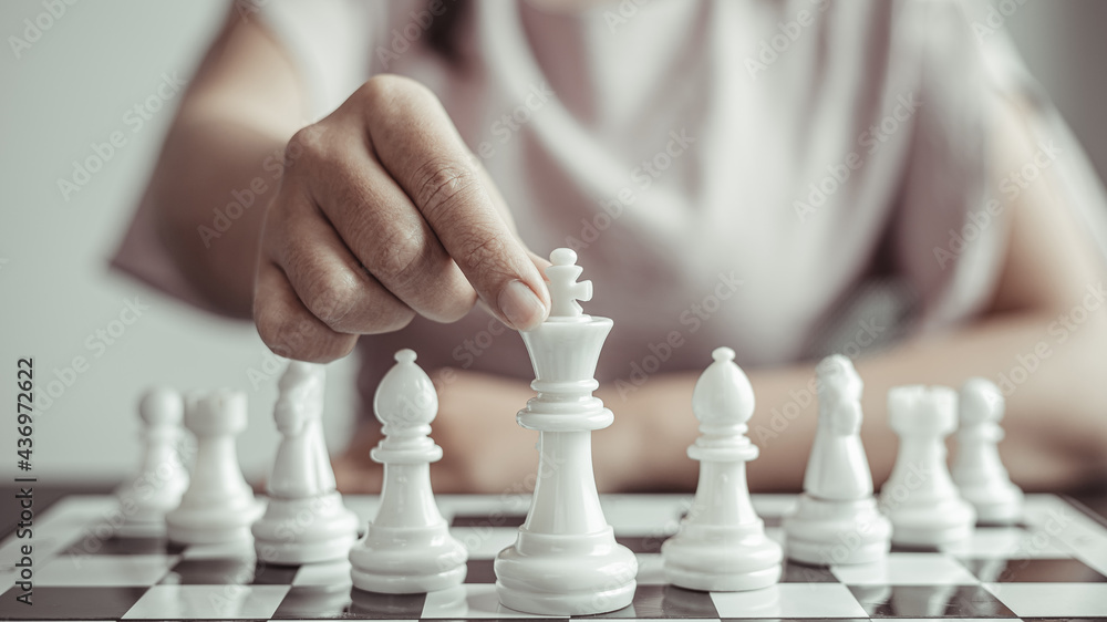 Businesswoman playing chess, Proactive business planning and marketing strategy just like playing chess, Business competition and success, Leadership concept. Businesswoman playing chess, Proactive business planning and marketing strategy just like playing chess, Business competition and success, Leadership concept.