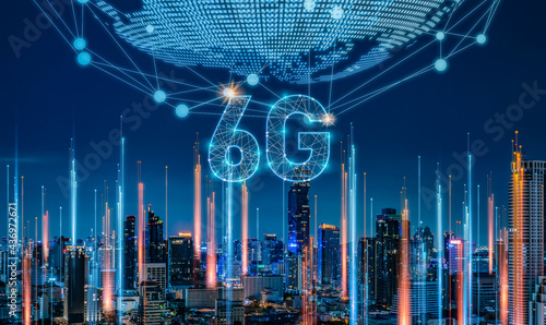 6G network digital and internet of everythings on city background.6G network wireless systems.Modern city with quantum internet and cityscape concept. photo