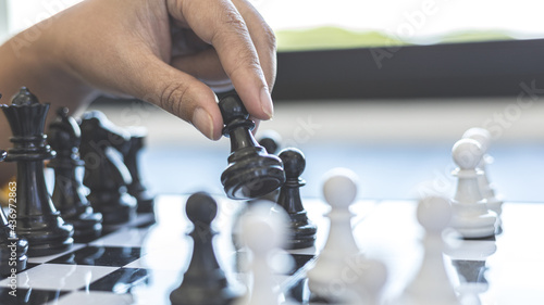 Businesswoman holding chess to take down opposing players, Proactive business planning and marketing strategy just like playing chess, Business competition and success, Leadership concept.