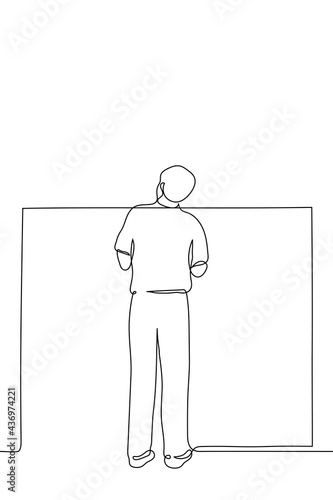 man stands and looks over the wall - one line drawing. concept of tall man spying on someone hiding behind a wall