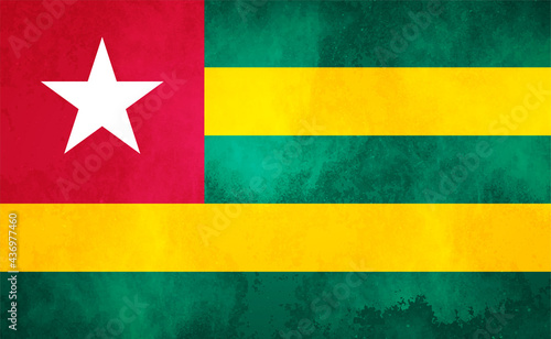 Watercolor texture flag of Togo. Creative grunge flag of Togo country with shining background