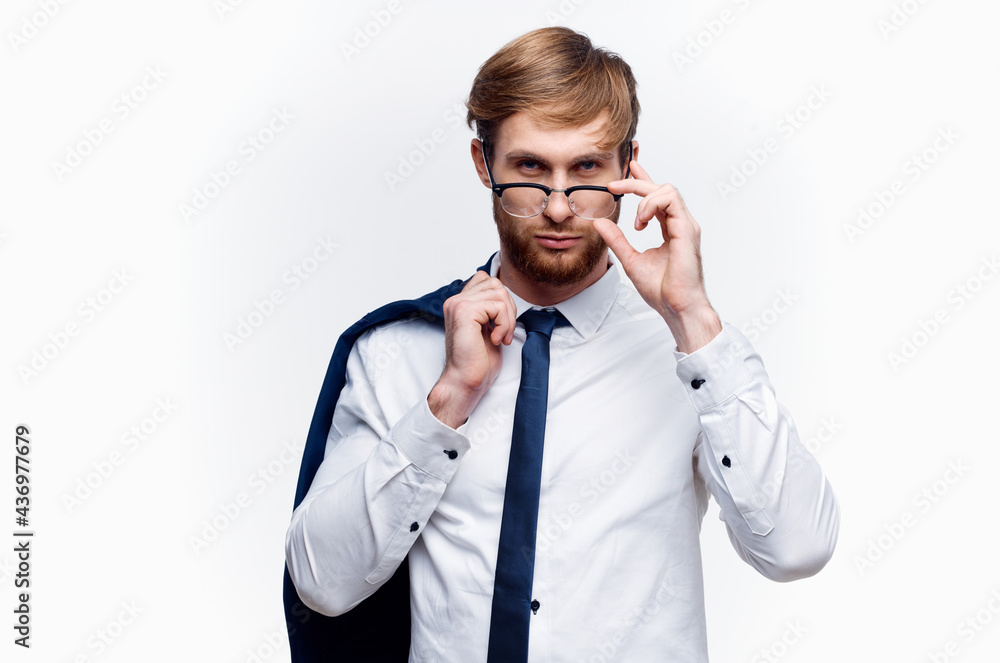 business man with a jacket over his shoulders wearing glasses self-confidence official business man with a jacket over his shoulders wearing glasses self-confidence official