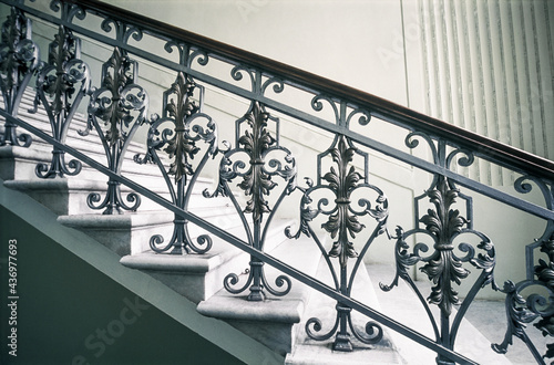Staircase with handrails and decor in an old building