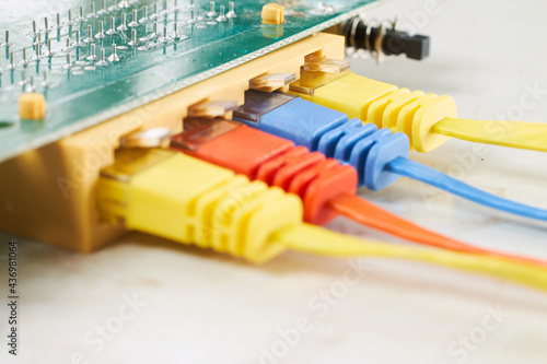 Colorful network cables connected to a green chip board
