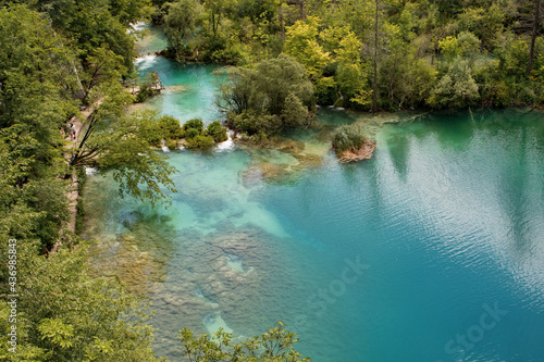 Idyllic scenery of turquoise lakes  lush greenery and waterfalls.