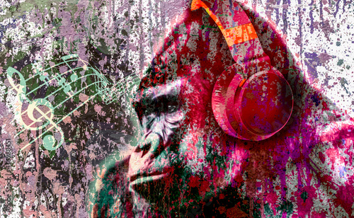 dj gorilla monkey head in headphone with creative colorful abstract elements on light background photo