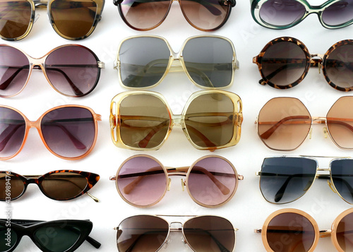 Variety of sunglasses on white background