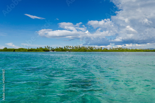 Mantatao Island in Calape, Bohol. A flat islet and teal colored tropical sea. Part of the Danajon Bank. photo