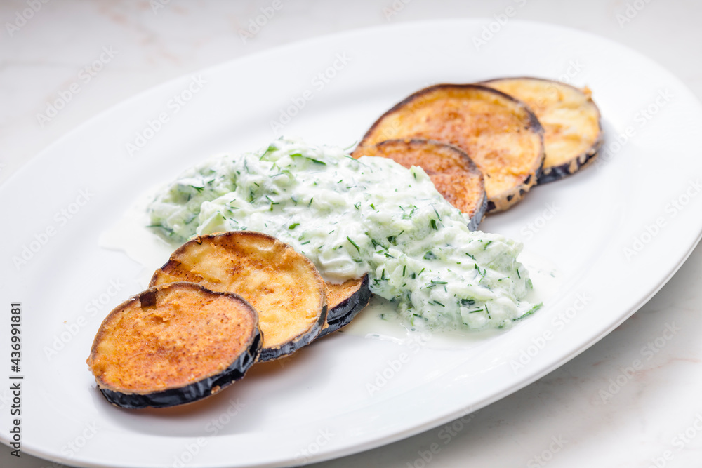 Greek tzaziki salad with fried aubergin Greek tzaziki salad with fried aubergin